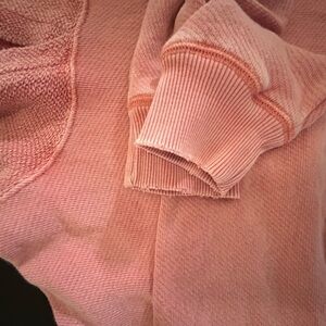 American Eagle Outfitters Pink Crew Neck Sweater is cozy and distressed look